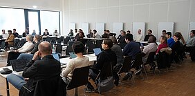 Participants during the opening ceremony in the conference hall.