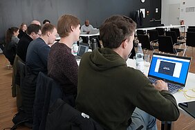 Students playing an icebreaker game on a computer.