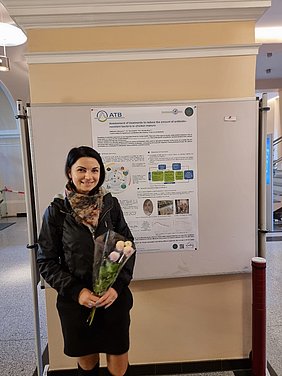 Aleksandra Atanasova in front of her poster