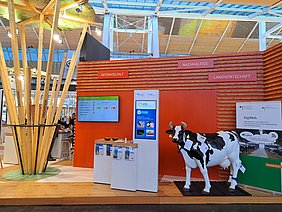 Exhibition booth of ATB with cow Rosa